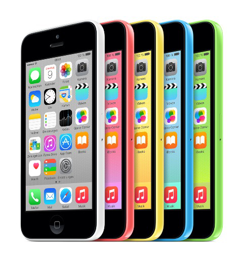 Sechs bunte Smartphones in einer Reihe, jedes mit einem anderen farbigen Gehäuse, nach vorne gerichtet.