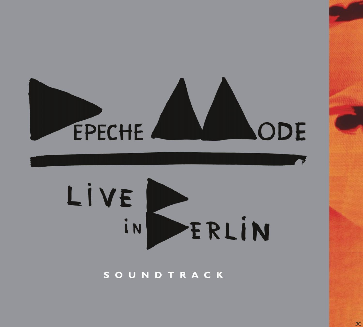 Albumcover für Depeche Mode: schwarze Dreiecke und Text auf grauem Hintergrund, 'Live in Berlin' und 'Soundtrack'.