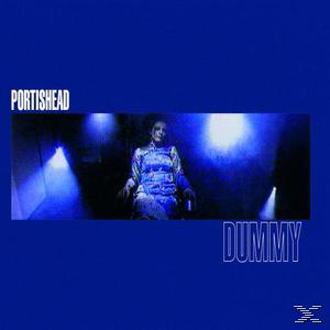 Albumcover mit einer Frau in blauem Outfit in einem blau beleuchteten Raum. Text sagt 'Portishead Dummy'.