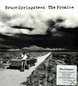 CD-Cover: Mann an einem Auto auf einer Straße, Text 'Bruce Springsteen The Promise'.