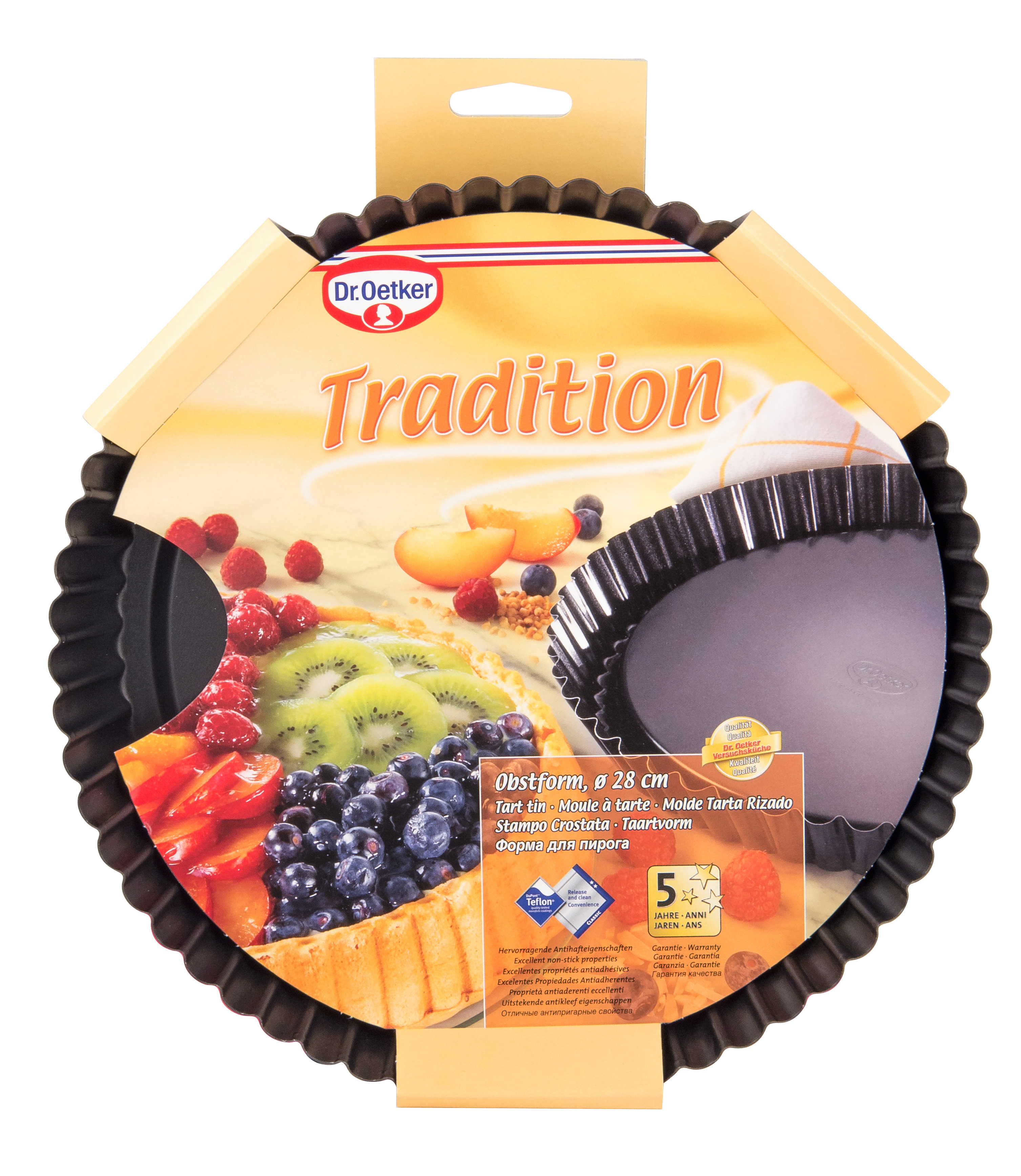 Eine runde Backform mit Früchten und Logo. Verpackung zeigt Kuchen mit Früchten und Markennamen.