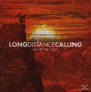 Albumcover: Long Distance Calling - Avoid The Light. Eine dunkle Landschaft mit rotem Himmel.