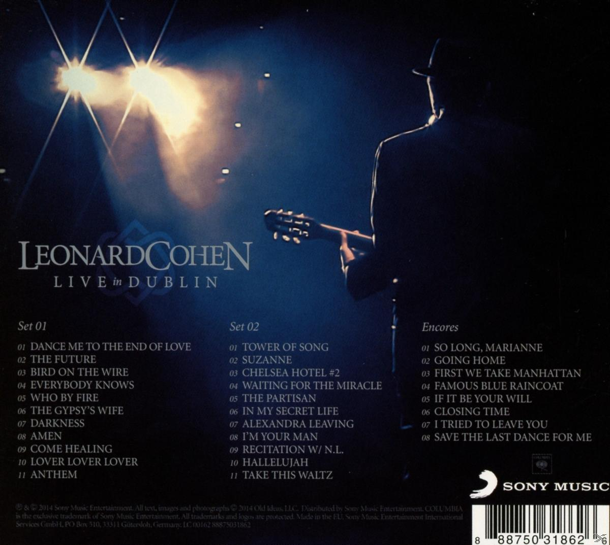 CD-hoes: Leonard Cohen, live op het podium. Blauwe achtergrond, spotlight, tekst 'Live in Dublin'.