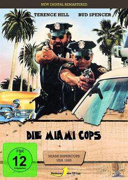DVD-Cover mit zwei Männern in Polizeiuniformen, die mit Waffen zeigen, Palmen und ein gelbes Auto. Text: 'Miami Cops'.
