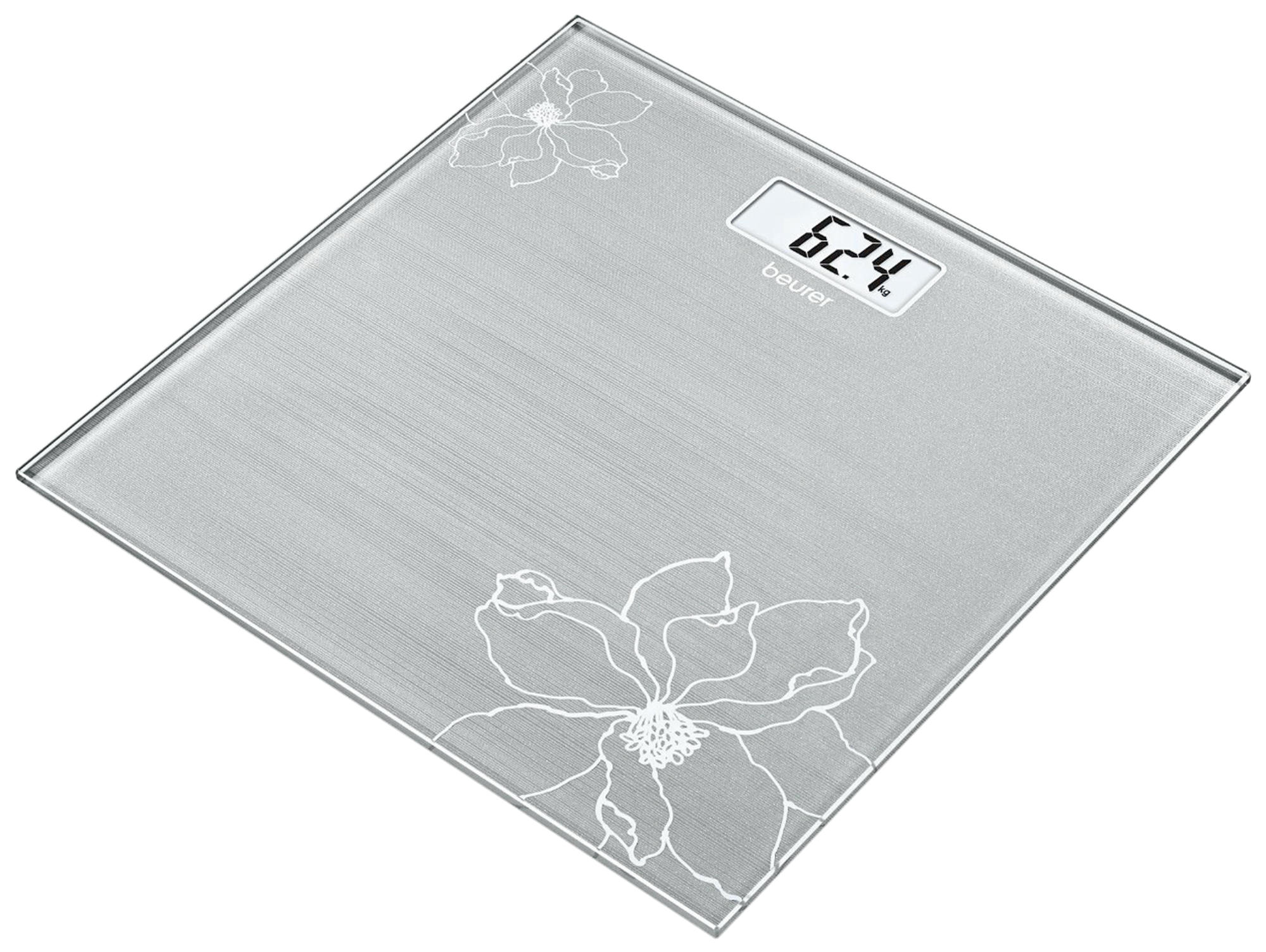 Eine Glaswaage mit digitaler Anzeige 62.4. Zwei Blumendesigns befinden sich auf der Waage.