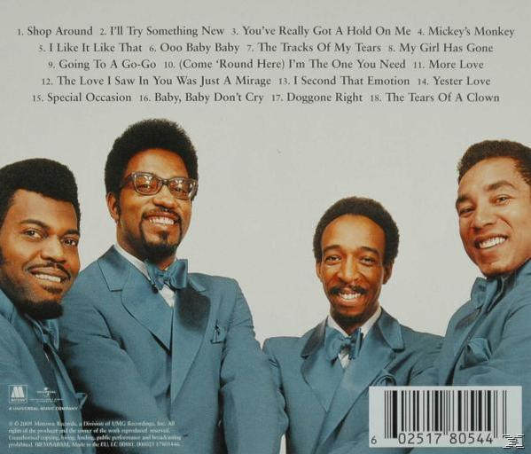 Quatre hommes en costume, souriant. Pochette d'album avec liste des titres.