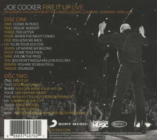 Joe Cocker auf der Bühne, Rücken zur Kamera, Arme erhoben. Konzertdetails und Titelliste sichtbar. Sony Music Logo.