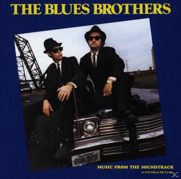 Albumcover mit Blues Brothers, in schwarzen Anzügen, auf einem Auto, mit Text und Logo.