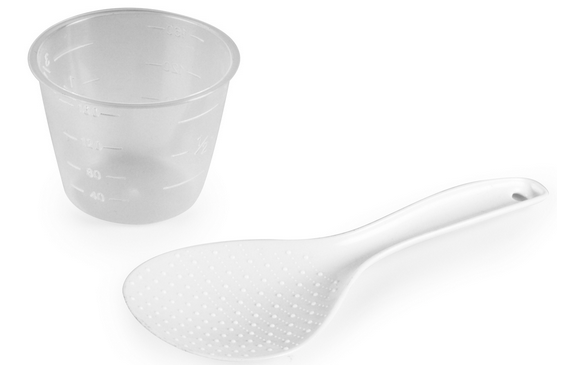 Clear plastic measuring cup and white rice spoon, both on a white background.