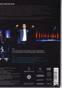 DVD-Rückseite mit einem Mann in einem blauen Jackett und etwas Text.