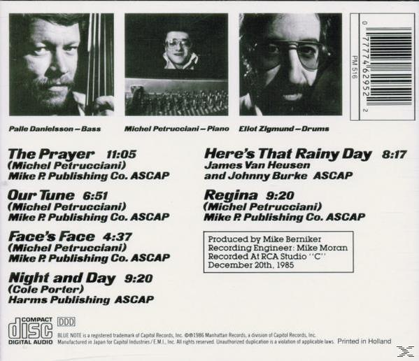 Rückseite einer CD mit Fotos von drei Männern und einer Titelliste. Die CD ist mit "Blue Note" gekennzeichnet. Aufnahmedetails sind vorhanden.