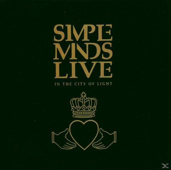 Albumcover in Dunkelgrün mit goldenem Text, einem Herz mit Händen und dem Text 'Simple Minds Live'.