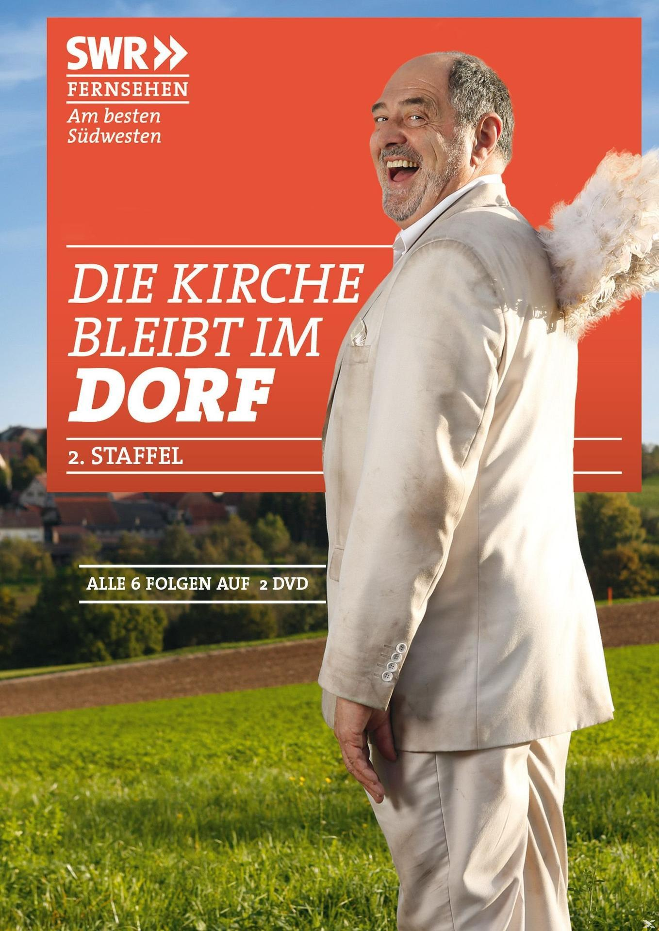 DVD-Cover mit einem Mann im Anzug mit Engelsflügeln, Text: Die Kirche bleibt im Dorf.