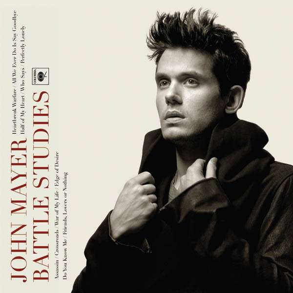 Album borító. John Mayer fekete kabátban, oldalsó profilja bézs háttérrel.