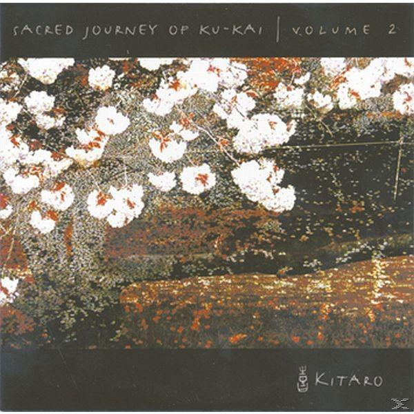 Album borító fehér virágokkal barna háttéren, és a 'Sacred Journey' felirattal.