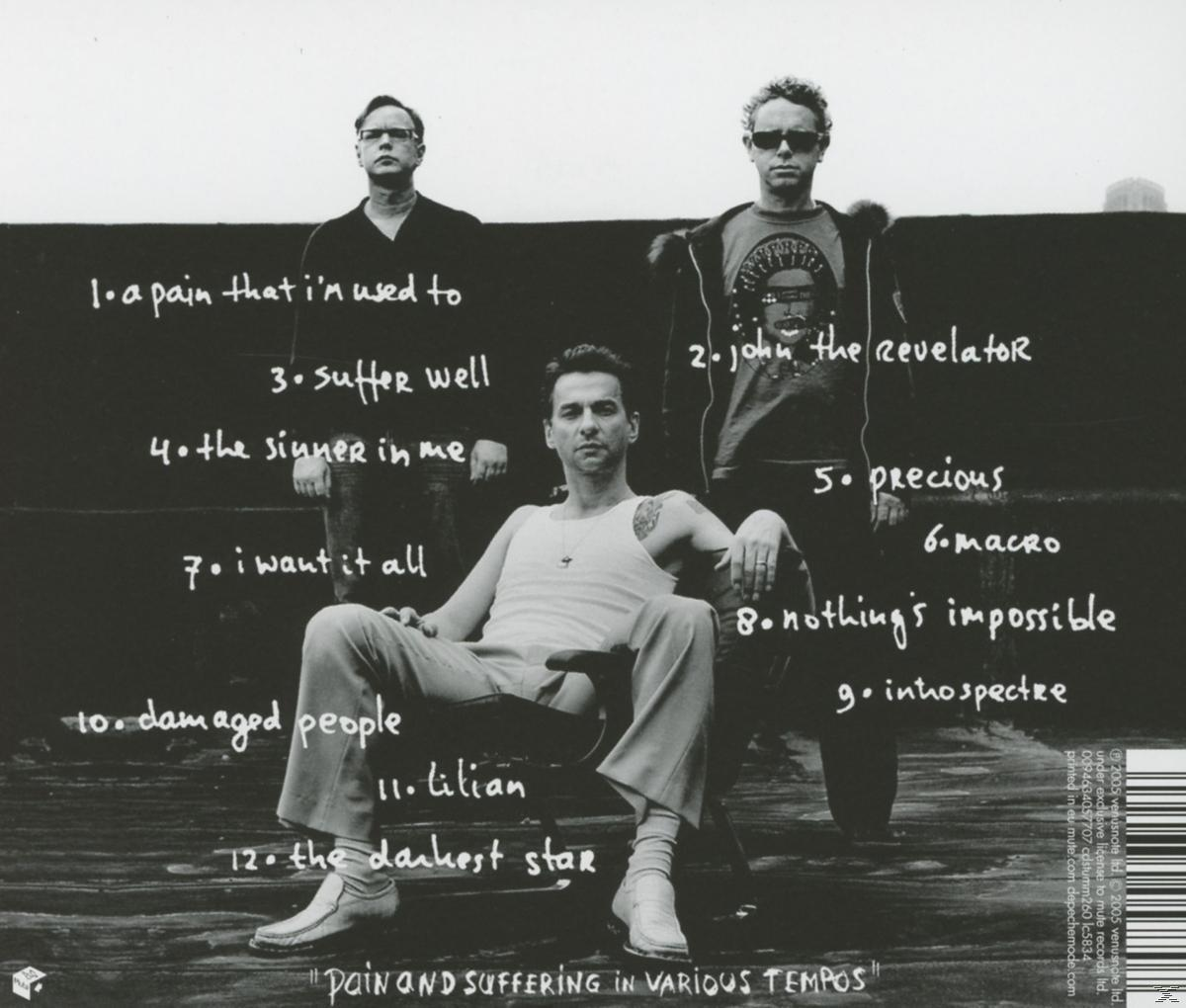Album-Rückseite. Drei Männer, mit Titelliste und Text.