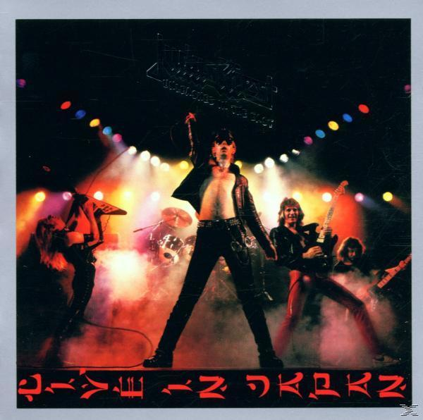 Albumcover: Band spielt live auf der Bühne. Sänger mit offenem Hemd. Bühnenbeleuchtung und Menge im Hintergrund. Text: Live in Japan.