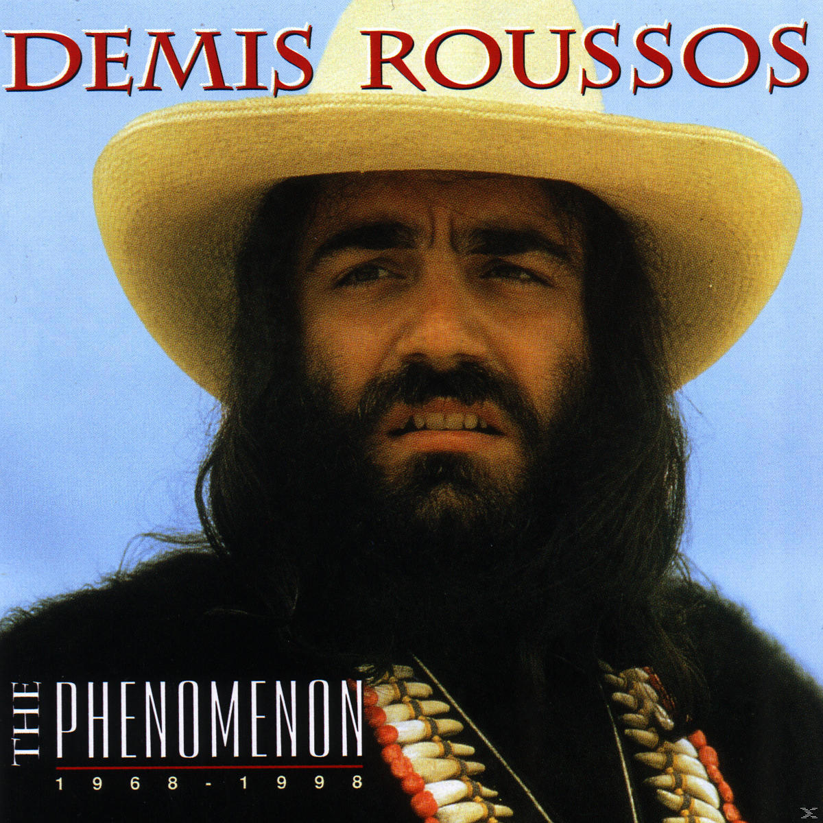 Pochette d'album de Demis Roussos. Il porte un chapeau et a une barbe. Le titre est 'The Phenomenon'.