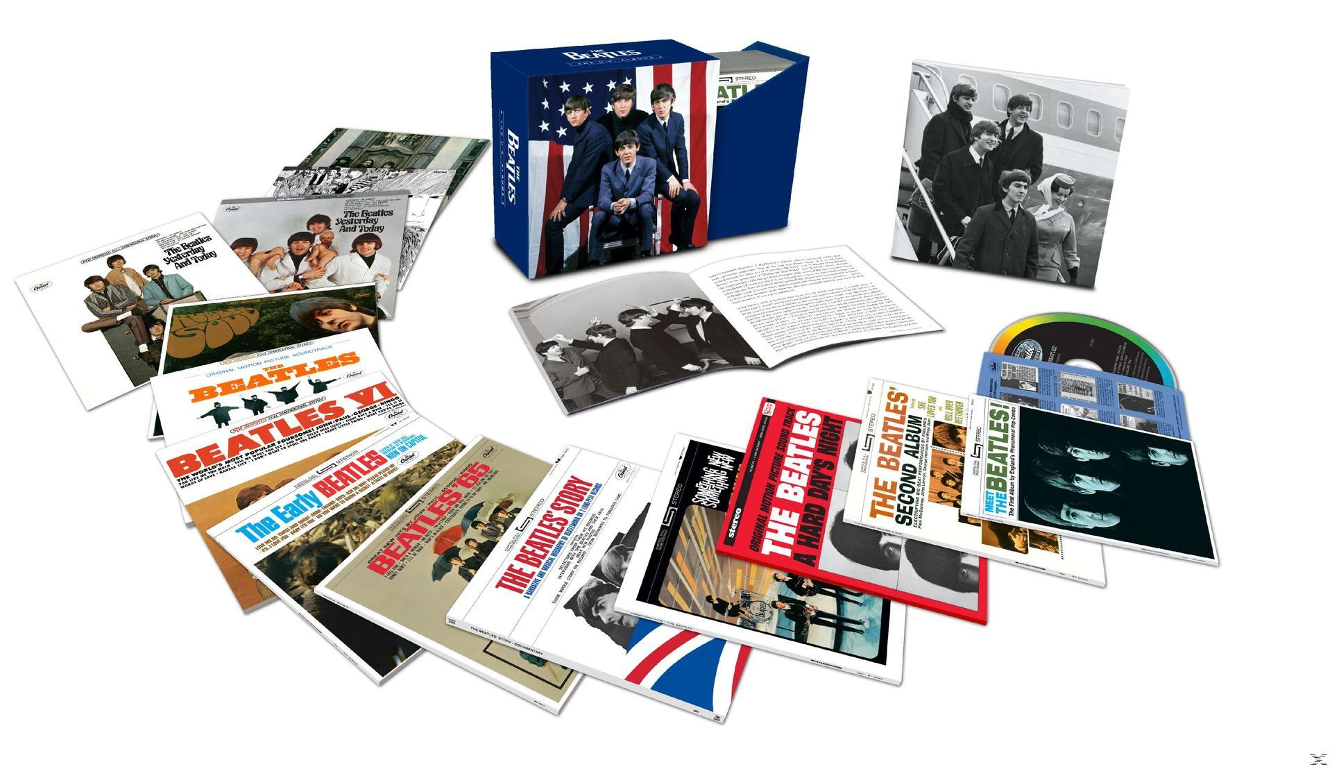 Beatles albumok dobozkészlete, körbe rendezve borítókkal és a zenekar fotójával.