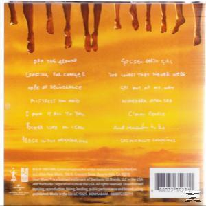 CD-Hülle mit Beinen, die in den Himmel hängen, gelber Hintergrund, Songtitel.