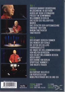 Rückseite einer DVD-Hülle. Der Text listet die Episoden auf. Mehrere Bilder eines Mannes in Rot.