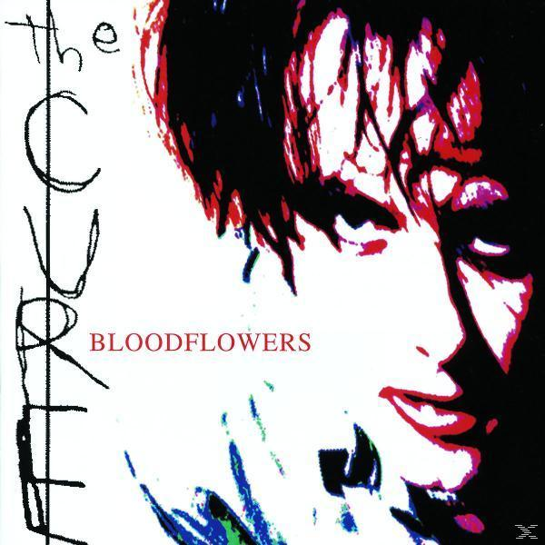 Albumcover mit Nahaufnahme eines Gesichts, mit rotem Text 'Bloodflowers' und 'The Cure'.