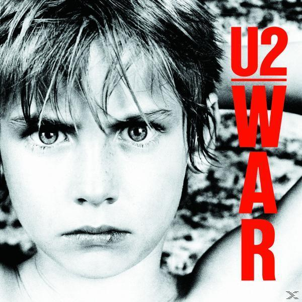 Pochette de l'album U2 WAR. Le visage d'un jeune garçon avec une expression sévère, U2 WAR en texte rouge.