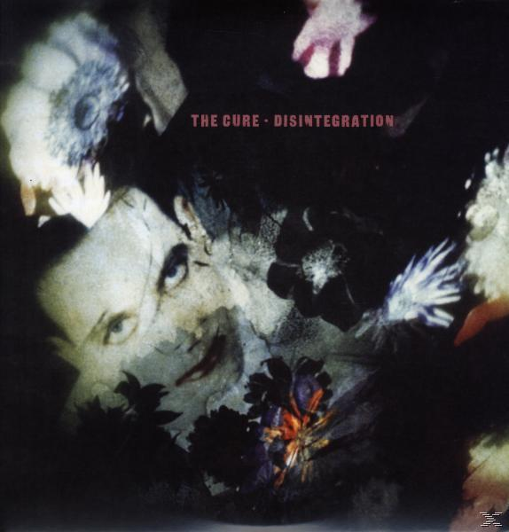 CD borító egy arccal a kép közepén. A szöveg: The Cure - Disintegration.