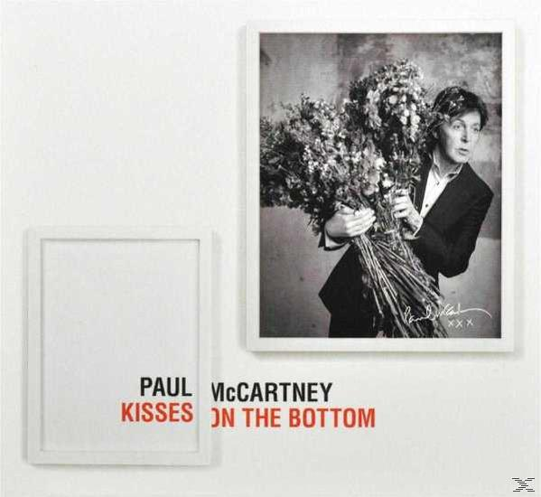 Albumcover von Paul McCartney, mit Blumen und einem gerahmten Bild.