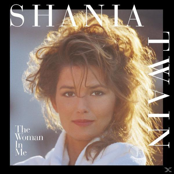 Album borítója egy nő arcával, a 'Shania Twain' és a 'The Woman In Me' feliratokkal.
