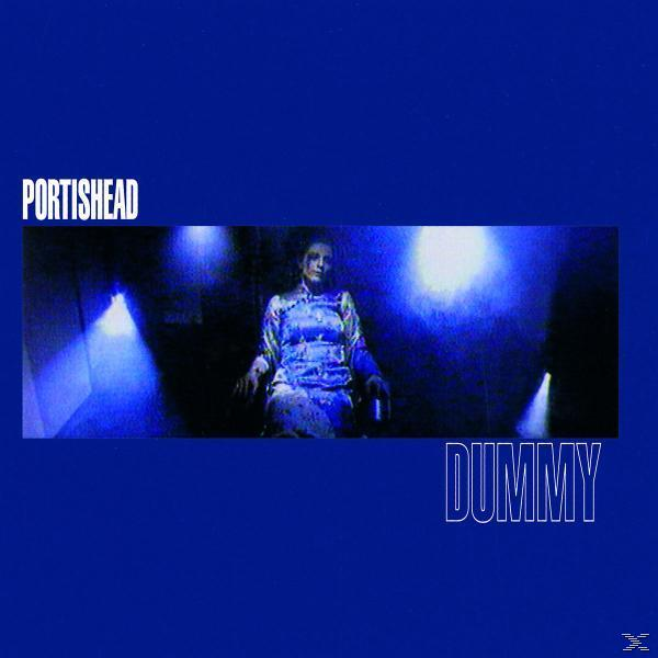 Albumcover mit sitzender Frau, blaue Beleuchtung. Der Titel ist 'Dummy' von Portishead.