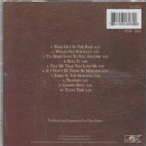 CD-Cover: Album-Trackliste auf braunem Hintergrund, mit Albumtitel und Künstler.