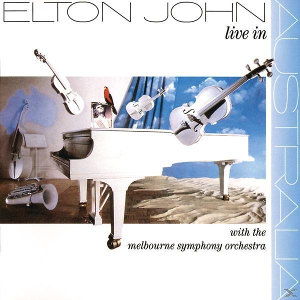 Albumhoes van Elton John live in Australië. Het toont muziekinstrumenten en een witte piano.