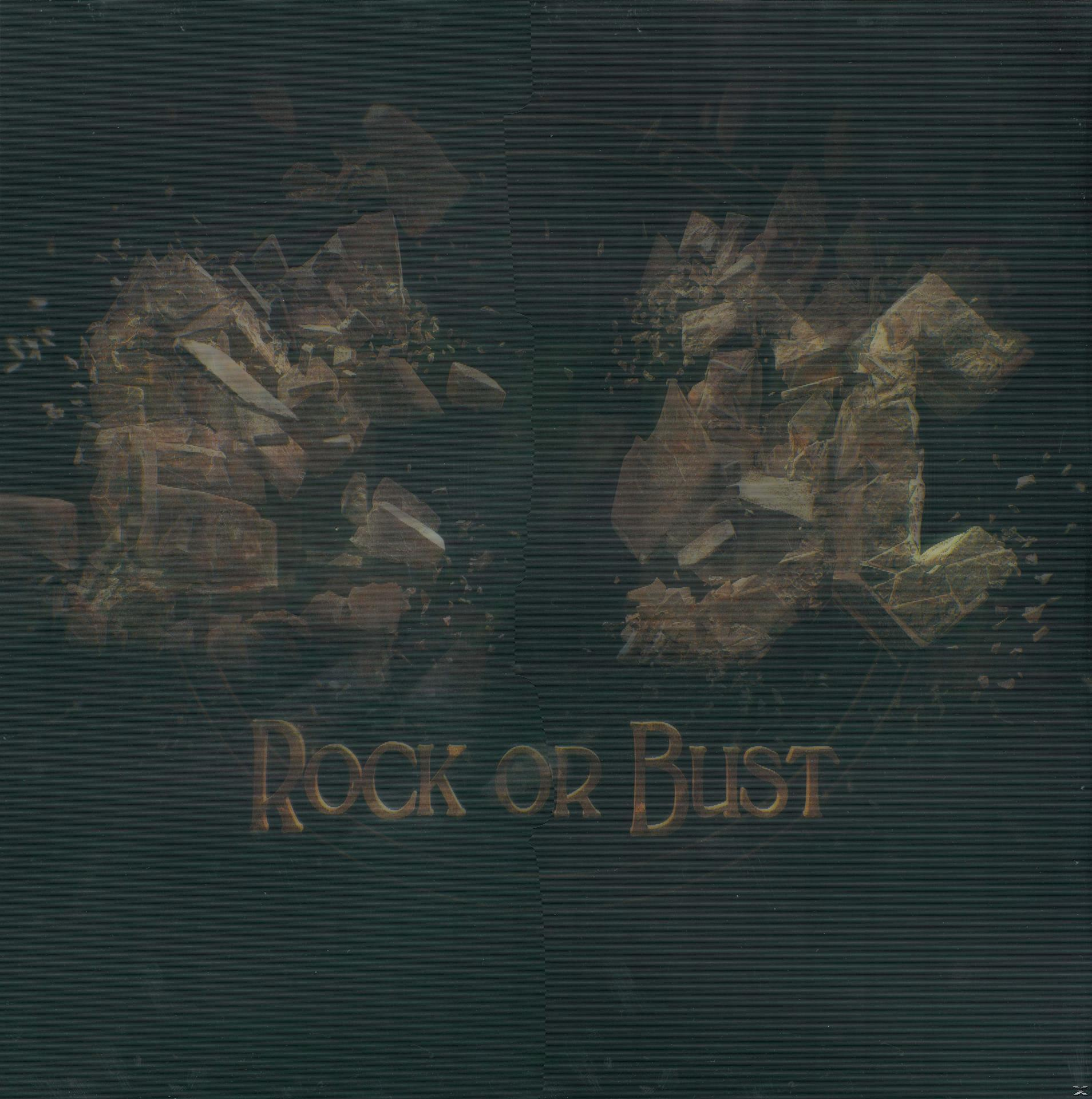 Albumhoes: AC/DC Rock or Bust. Een donkere achtergrond met gebroken rotsachtige vormen en tekst.
