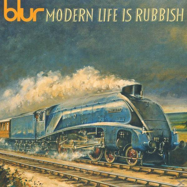 Album borító kék gőzmozdonnyal felhős égbolton.