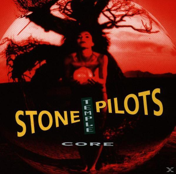 Temple Pilots Albumcover. Frau hält eine Kugel vor rotem Hintergrund.