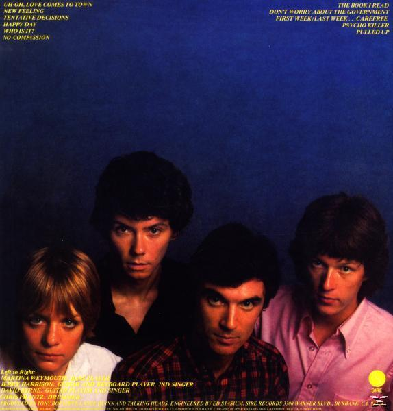 Albumcover mit vier Bandmitgliedern. Blauer Hintergrund. Weißer Text. Songtitel links.