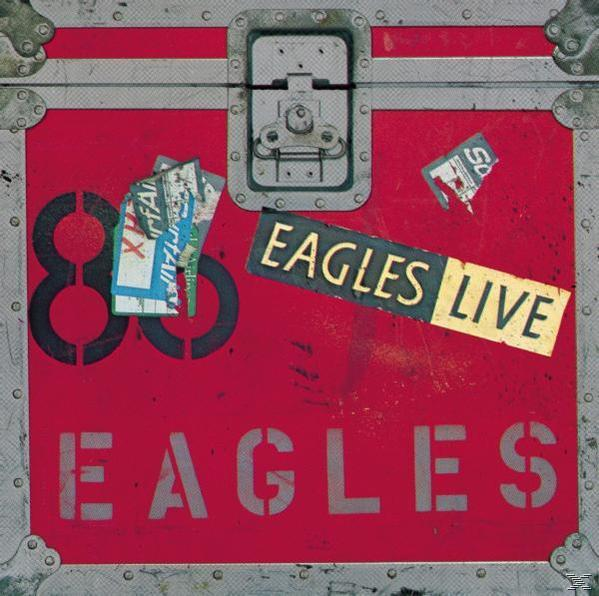 Albumcover mit rotem Hintergrund, schwarzer Zahl 86 und Text 'EAGLES LIVE'. Flecken und Aufkleber vorhanden.