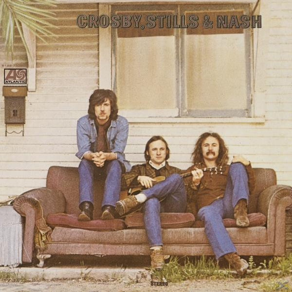Albumcover von Crosby, Stills & Nash, drei Männer auf einem Sofa vor einem Haus.
