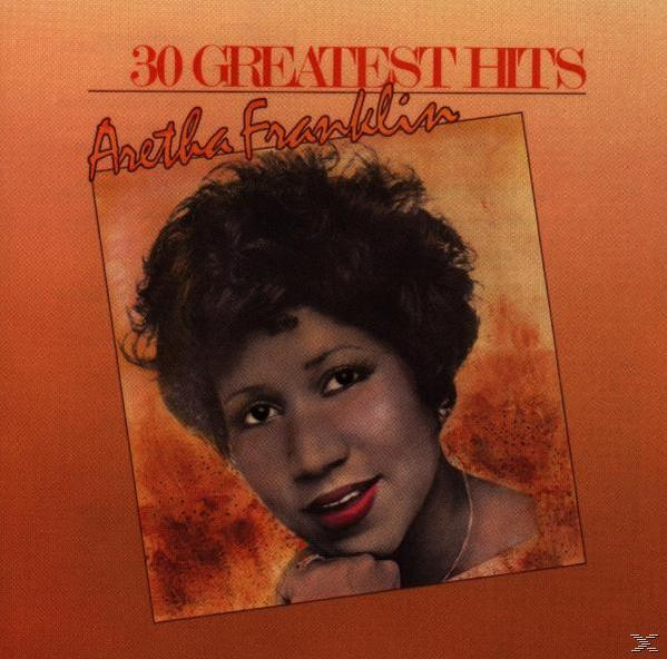 Albumcover mit dem Gesicht einer Frau und den Worten '30 Greatest Hits' auf orangefarbenem Hintergrund.