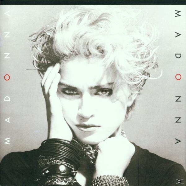 Madonna-Albumcover, Nahaufnahme ihres Gesichts mit ernstem Ausdruck und dunklem Hintergrund.