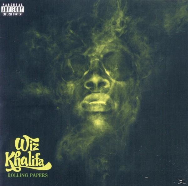 Albumcover von Wiz Khalifas 'Rolling Papers'. Ein Gesicht mit Raucheffekt und Text.