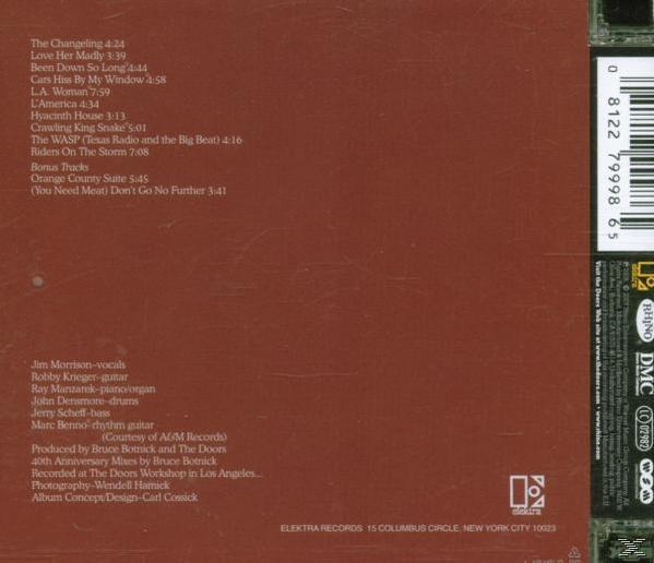 Die Rückseite eines Albums mit einer Titelliste und Credits. Brauner Hintergrund. Barcode oben.