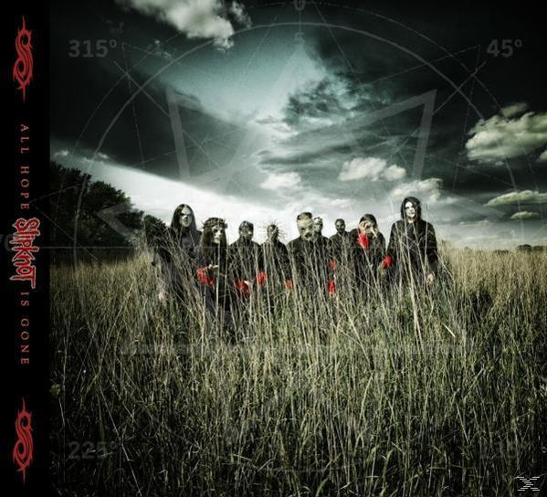 Slipknot album borítója maszkkal a tagok magas fűben állnak.