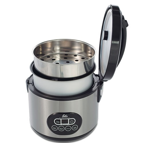 A stainless steel rice cooker with a steamer basket open. The control panel is visible.