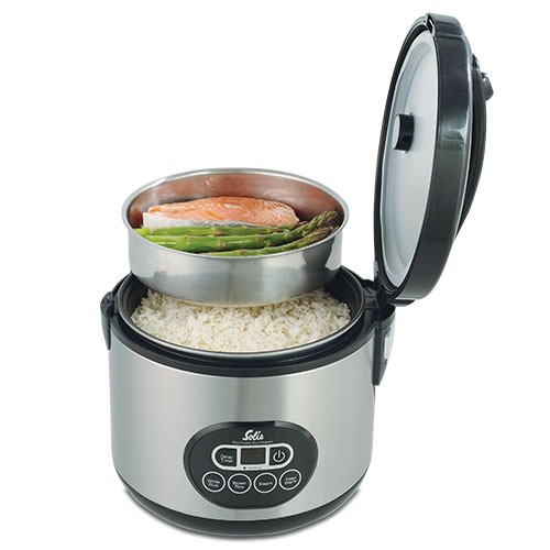 Stainless steel rice cooker with open lid and stainless steel steamer basket with food inside.