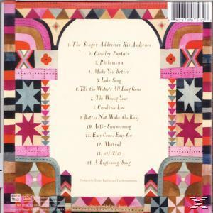 Albumcover: Buntes geometrisches Design mit Songtiteln und Text.