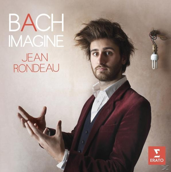 Ein Mann mit wildem Haar hält die Hände, eine Glühbirne hängt, Albumcover.