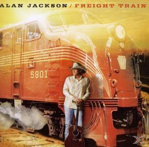 Alan Jackson Albumcover mit einem Mann, der eine Gitarre vor einem roten Zug hält.