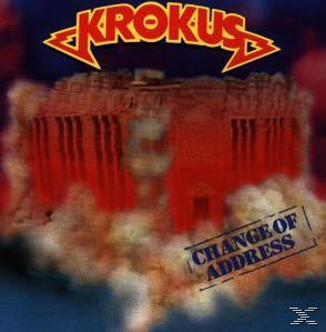 CD-Cover. Der Titel ist Krokus, Change of Address. Bild eines roten Gebäudes auf Wolken mit dem Bandnamen oben.
